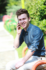 Image showing Russian man in park with telephone