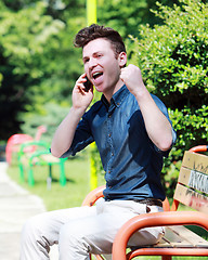 Image showing Happy young man on telephone