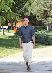 Image showing Young man walking in park