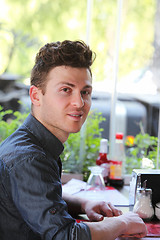 Image showing Young man at restaurant