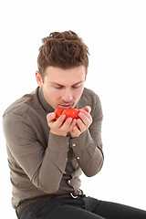 Image showing Vertical portrait of man with tomatoes