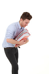 Image showing Young man smiling with folders