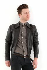 Image showing Young adult man posing with leather jacket