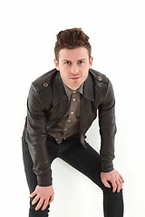 Image showing Young adult man posing with leather jacket