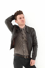 Image showing Young adult man posing with leather jacket