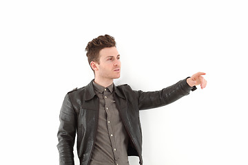 Image showing Young adult man posing with leather jacket