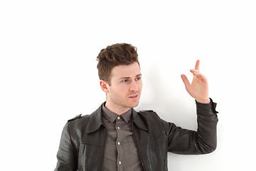 Image showing Young adult man posing with leather jacket