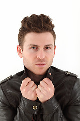 Image showing Young adult man posing with leather jacket