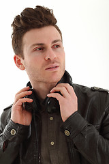 Image showing Young adult male portrait listening music