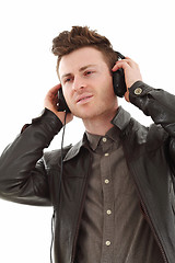 Image showing Young adult male listening music