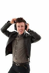 Image showing Young adult male listening music