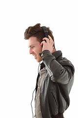 Image showing Profile of young adult male listening music