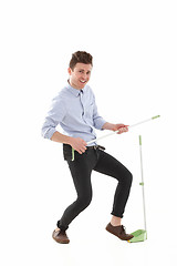 Image showing Handsome man dancing and cleaning