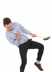 Image showing Handsome man dancing and cleaning