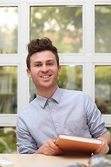 Image showing Young adult man with note book