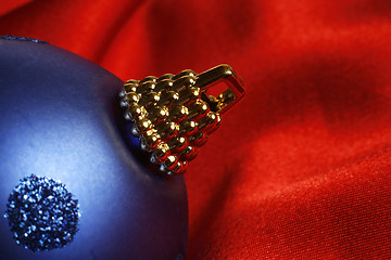 Image showing Blue xmas ball on satin