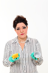 Image showing Woman in carrier cleaning a mug