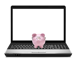 Image showing Piggy bank on laptop