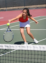 Image showing Young girl playing tennis