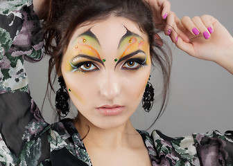 Image showing Portrait of cute girl with idnian make up and earrings