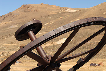 Image showing Old iron wheel in the ghost town of Bodie California