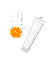 Image showing Splashing orange into a water with cosmetic tube