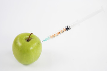 Image showing Green apple with syringe