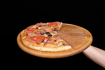 Image showing Pizza and slice of pizza in hand