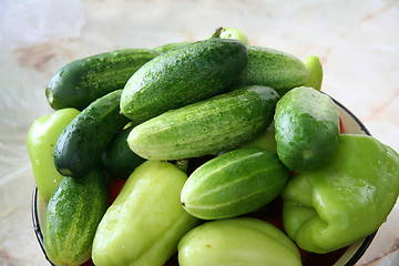 Image showing Fresh salted cucumbers with green pepper