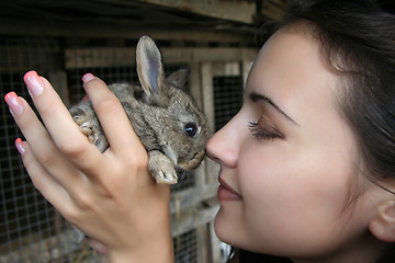 Image showing Closeup portrait of a pretty girl with a rabbit