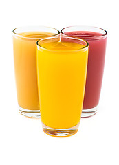 Image showing Tropical juices in glasses isolated on white