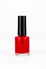 Image showing red nail polish bottle on white background