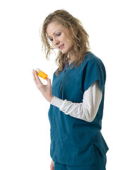 Image showing Nurse reading the label
