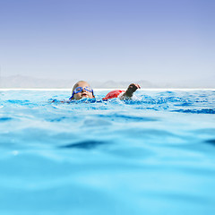 Image showing Boy in infinity pool