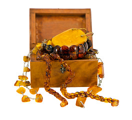 Image showing Amber apparel jewelry retro wooden box on white 