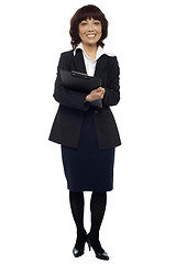 Image showing Female secretary holding clipboard, waiting for boss
