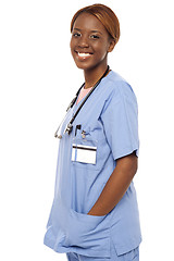 Image showing African female nurse posing casually in uniform