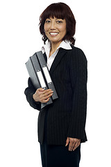 Image showing Smiling businesswoman holding her file folder