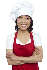 Image showing Confident smiling chef posing with her arms crossed