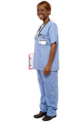 Image showing Medical expert holding clipboard, full length shot