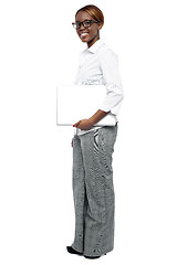 Image showing Full length shot of businesswoman with laptop