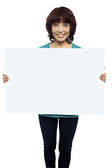 Image showing Woman holding billboard, your ad here