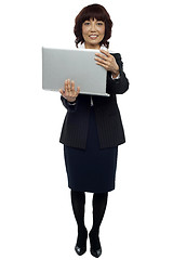 Image showing Business representative holding laptop