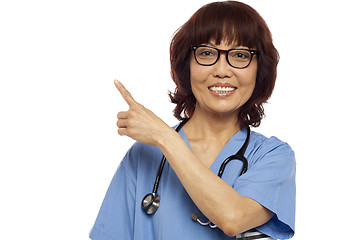 Image showing Nurse pointing at the copy space