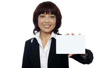 Image showing Business lady showing blank placard to camera