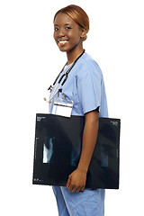 Image showing Nurse carrying x-ray reports to doctor