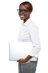 Image showing Cheerful business consultant carrying laptop