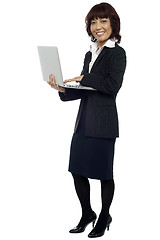 Image showing Lets get back to work. Woman with laptop