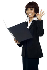 Image showing Lady consultant satisfied with the report