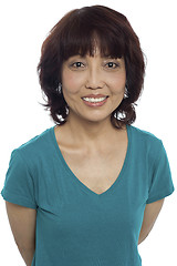 Image showing Picture of a smiling asian lady posing casually